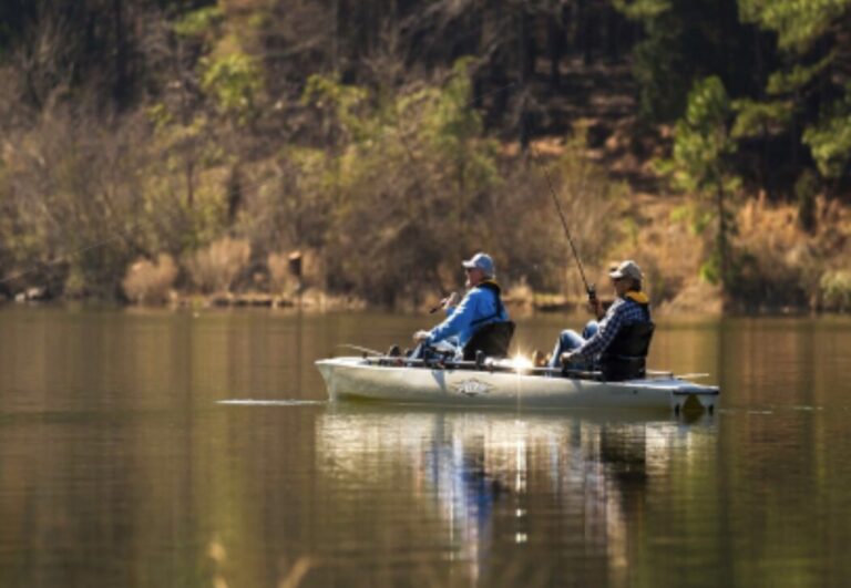 two people fishing in a lake